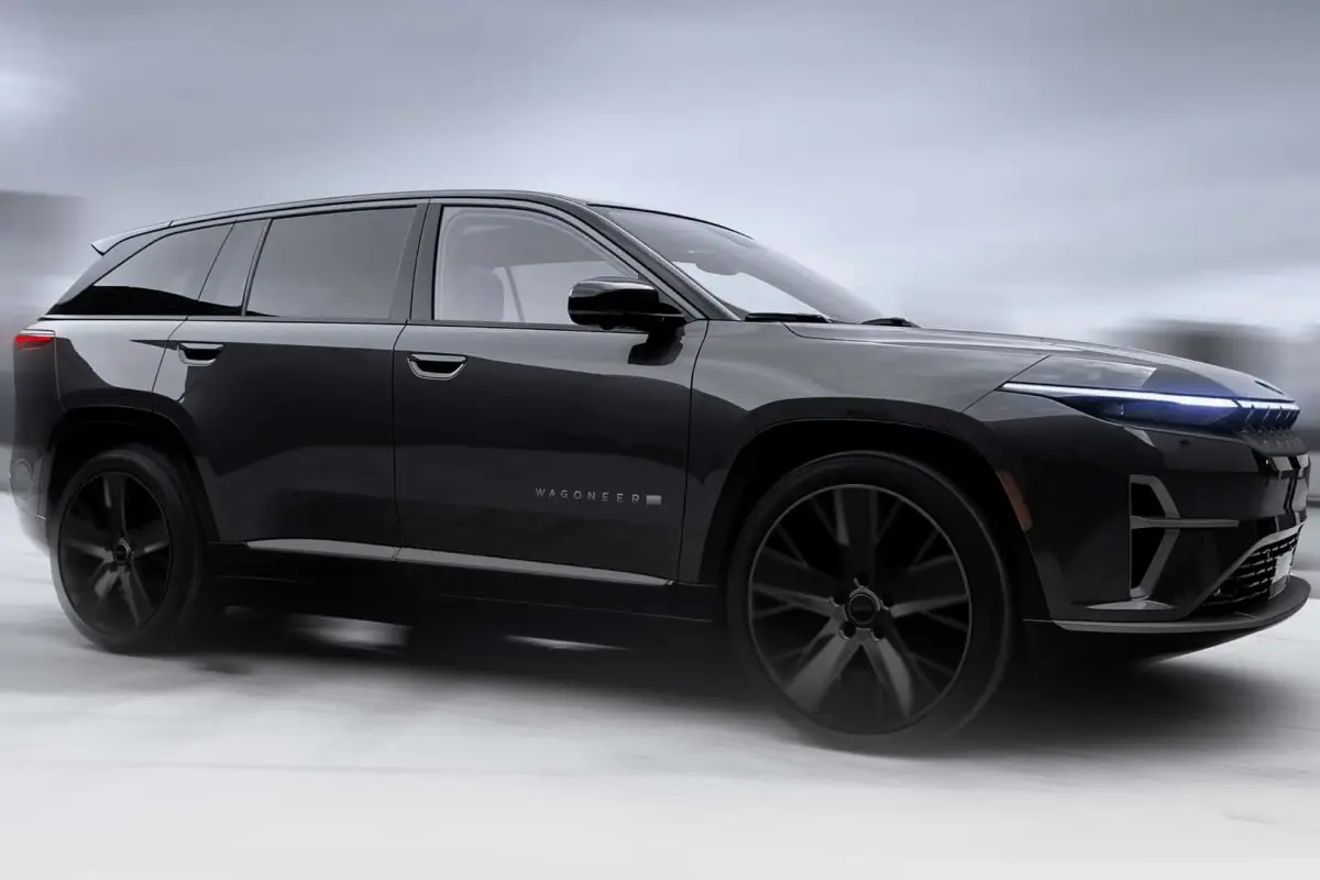 Black Jeep Wagoneer S electric SUV side profile in a moody studio setting