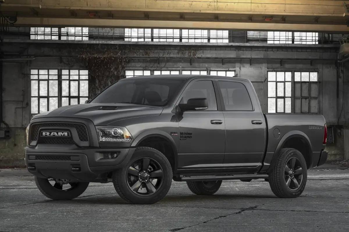 Gray Ram 1500 Warlock pickup truck parked inside an industrial warehouse with large windows