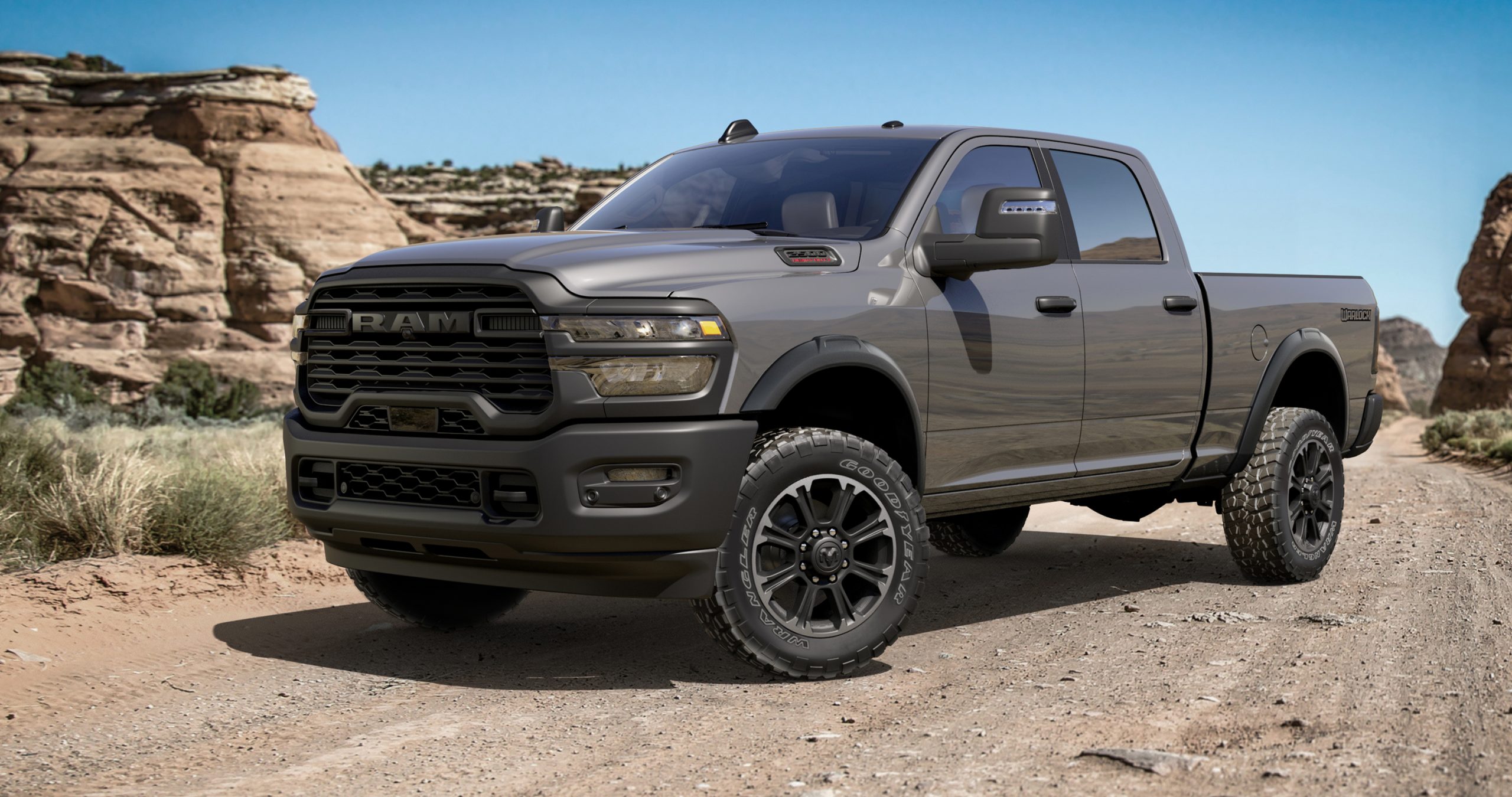 2026Gray 2025 Ram 2500 Heavy Duty Warlock pickup truck parked on a desert trail near red rock canyon formations